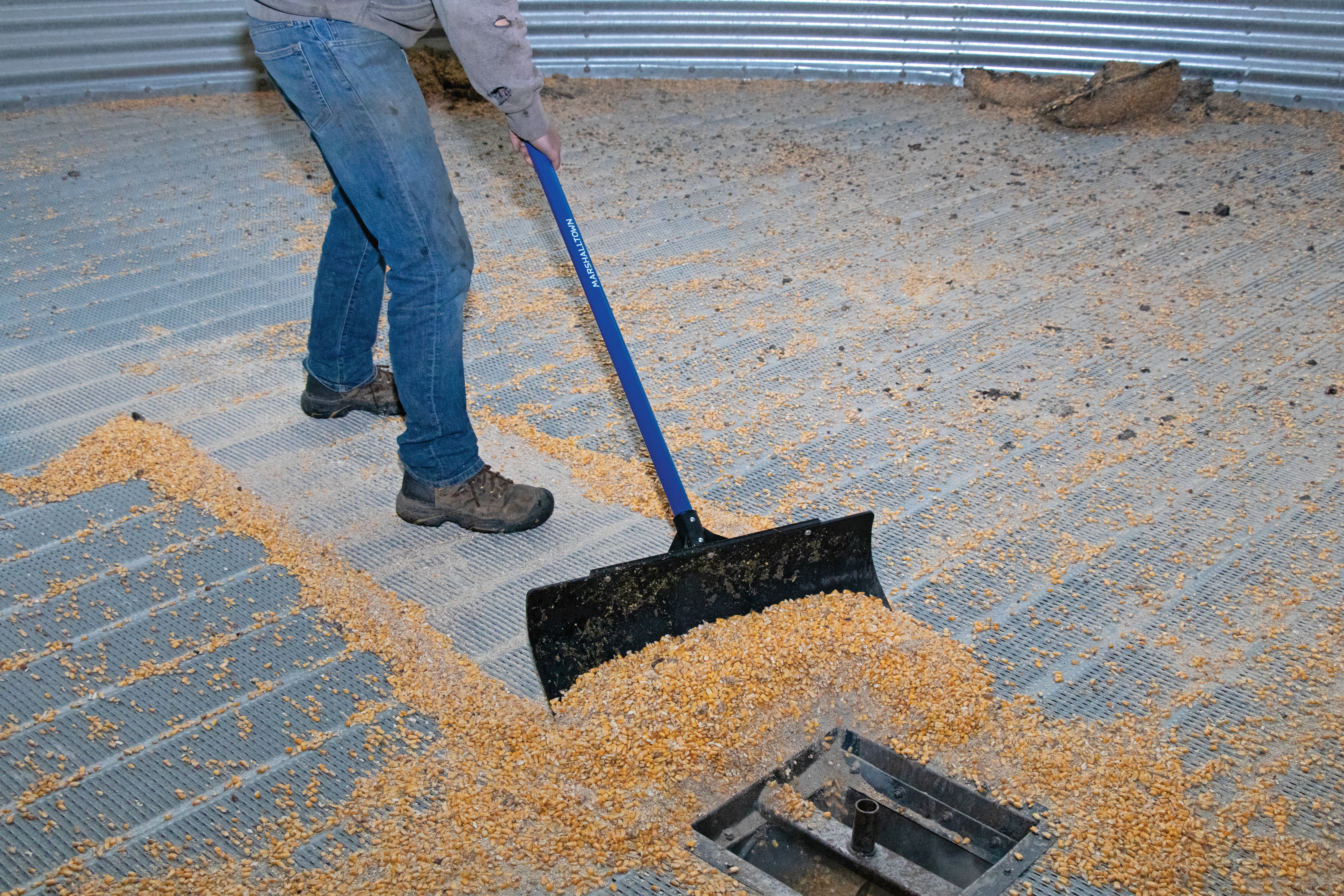 man pushing corn with the polar pusher
